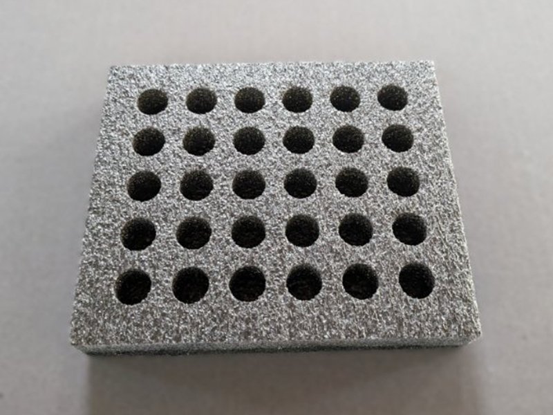 19 Die cut holes in polyethylene foam packaging for holding bottles
