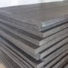 Black polyethlyene PE foam sheets that are 4' x 9' stacked in a pile