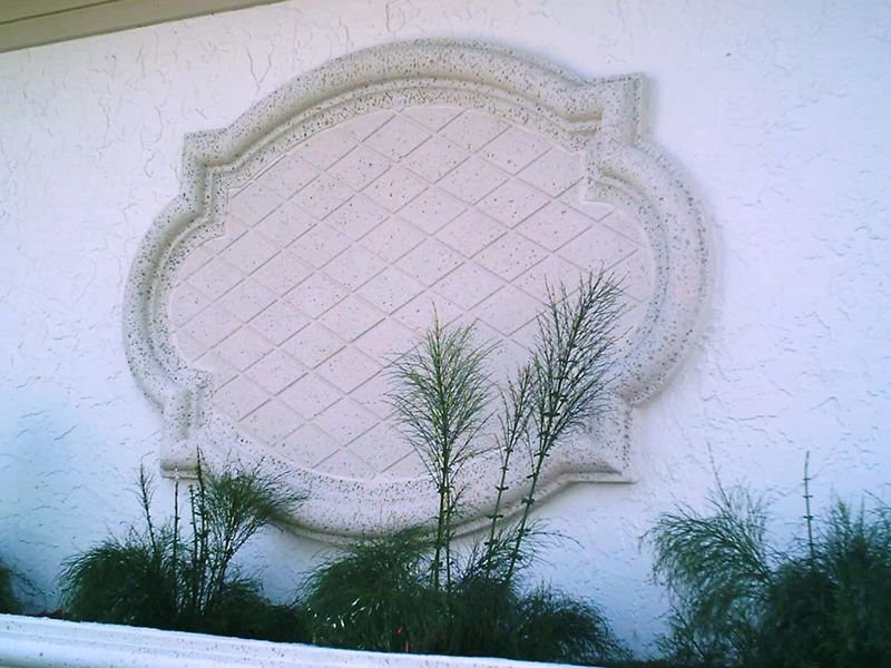 Geometric Medallion with frame and crisscross lines from Architectural Foam on a house