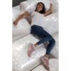 Girl laying on bags of packing peanuts loose fill