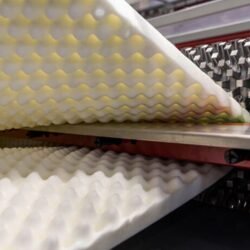 Machine manufacturing convoluted eggcrate foam