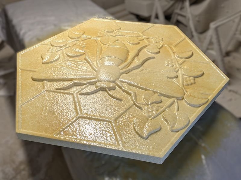 Manufacturing a foam spider medallion with urethane polyuria hard coat