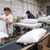 Manufacturing pillows filled with shredded foam in a factory