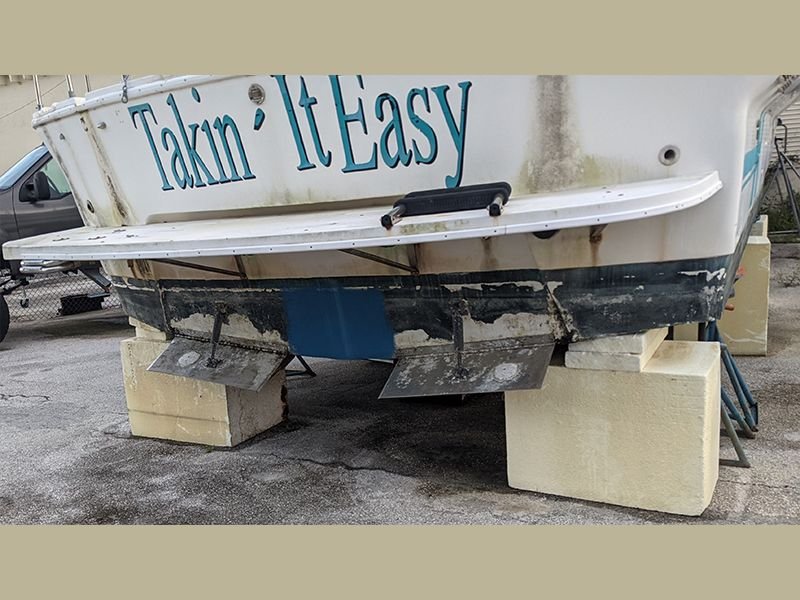 boat laying on top of Styrofoam expanded polystyrene EPS foam boat stands on land
